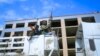 FILE - Armed Tigray forces guard prisoners as they ride through the streets in Mekele, the capital of the Tigray region of northern Ethiopia, Oct. 22, 2021. A new report says detained Tigrayan soldiers were massacred at a camp in southern Ethiopia in November 2021.