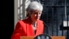British Prime Minister Theresa May reacts as she turns away after making a speech in the street outside 10 Downing Street in London, England, May 24, 2019. 
