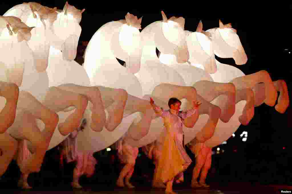 Acrobats from Compagnie des Quidams perform during the "White Night" cultural event in Skopje, Macedonia, Oct. 1, 2016.