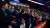 Donald Trump enters Republican convention hall with a bandaged ear and gets a hero's welcome