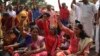 FILE - Protestors block traffic and shout slogans reacting to reports of two women of menstruating age entering the Sabarimala temple, in Thiruvananthapuram, Kerala, India, Jan. 2, 2019.
