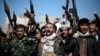 Tribesmen loyal to Houthi rebels hold their weapons as they chant slogans during a gathering aimed at mobilizing more fighters into battlefronts in several Yemeni cities, in Sana'a, Yemen, Nov. 24, 2016.