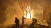 Rescuers work at the site of buildings damaged by shelling in Mykolaiv, Ukraine, in this handout picture released March 23, 2022. (Press service of the State Emergency Service of Ukraine/Handout via Reuters)