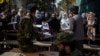 Afghans gather at the government passport office in Kabul, Afghanistan, Oct. 17, 2021. 