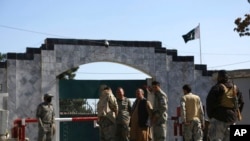 FILE - Security stands guard in front of the Pakistan embassy in Kabul, Afghanistan, Nov. 4, 2019.