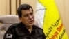 Syrian-Kurdish commander, Mazloum Abdi, of the U.S.-backed Syrian Democratic Forces, speaks during a news conference in Hassakeh, Syria, Saturday, Nov. 26, 2022. 