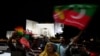 Supporters of former Pakistan's Prime Minister Imran Khan celebrate in Islamabad on July 26, 2022, after the Supreme Court declared that Khan's candidate should be the next Chief Minister of Punjab province.