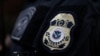 FILE - The badge of a field office director for the U.S. Immigration and Customs Enforcement's (ICE) Enforcement and Removal Operations in Hawthorne, California, on March 1, 2020.