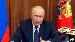 Presiden Rusia Vladimir Putin menyampaikan pidato tahunannya di Moskow, Russia, Wednesday, Sept. 21, 2022. (Russian Presidential Press Service via AP)