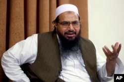 FILE - In this April 3, 2012, photo, Hafiz Mohammed Saeed, founder of Lashkar-e-Taiba, talks with the Associated Press in Islamabad, Pakistan.