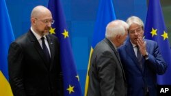 Ukrainian Prime Minister Denys Shmyhal, left, European Union foreign policy chief Josep Borrell, center, and European Commissioner for Economy Paolo Gentiloni attend the EU-Ukraine Association Council at the European Council, Brussels, Sept. 5, 2022. 