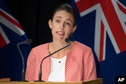 New Zealand Prime Minister Jacinda Ardern announces the country will move to a COVID red traffic light setting during a press conference at Parliament in Wellington, Jan. 23, 2022.