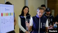 FILE - Director-General of the International Atomic Energy Agency (IAEA) Rafael Grossi speaks to reporters after his return from Ukraine where he and his team visited the Zaporizhzhia nuclear plant, at Vienna airport, in Schwechat, Austria, Sept. 2, 2022.