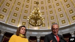 Senate Minority Leader Sen. Chuck Schumer of N.Y., right, speaks as he stands next to House Speaker Nancy Pelosi of Calif., left, on Capitol Hill in Washington, Monday, Aug. 3, 2020. Schumer and Pelosi met earlier with Treasury Secretary Steven…