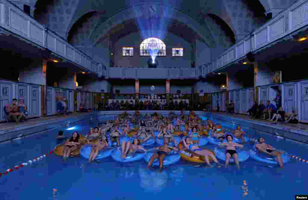 People attend the screening of the film Jaws by director Steven Spielberg, screened at Strasbourg public baths during the European Fantastic Film Festival, in Strasbourg, France, Sep. 18, 2016.