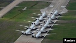 American Airlines passenger planes are parked on a runway due to flight reductions to slow the spread of coronavirus disease (COVID-19), at Tulsa International Airport in Tulsa, Oklahoma, March 23, 2020.