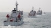 Taiwan Coast Guard patrol ships are seen during a drill held about 30 nautical miles northwest of the port of Kaohsiung, southern Taiwan, March 30, 2013. 