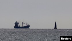 A U.S.-flagged cargo vessel carrying aid for Palestinian civilians caught in the conflict between Israel and Hamas sets sail from Larnaca, Cyprus, May 9, 2024.