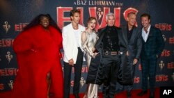 FILE - From left, Yola, Austin Butler, Olivia Dejonge, director Baz Luhrmann, Tom Hanks and Luke Bracey pose for photographers upon arrival for the premiere of the film 'Elvis' in London, Britain, May 31, 2022. 