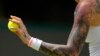 Tereza Martincova of the Czech Republic prepares to serve to Karolina Pliskova of the Czech Republic in a singles tennis match on day three of the Wimbledon tennis championships in London, June 29, 2022.