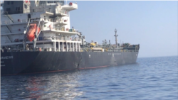 The damage to the M/T Kokuka Courageous, at left. The crew of 21 sailors abandoned ship after discovering a probable unexploded limpet mine on their hull, at right, following an initial explosion, according to a statement from U.S. Central Command.
