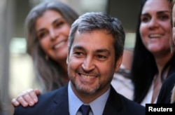 FILE - Paraguayan elected President Mario Abdo Benitez smiles while arriving for the beatification of Maria Felicia de Jesus Sacramento, known as Chiquitunga in Asuncion, Paraguay, June 23, 2018.