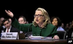 FILE - Then-Secretary of State Hillary Clinton testifies on Capitol Hill in Washington before the Senate Foreign Relations Committee hearing on the attack on the U.S. diplomatic mission in Benghazi, Libya, Jan. 23, 2013.