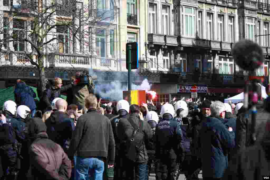 Calling themselves ‘Casuals Against Terrorism’ the group set off flares and was eventually repelled with water cannons. (H. Murdock/VOA)