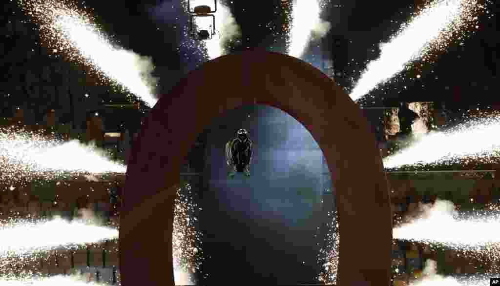 Wheelchair extreme athlete Aaron 'Wheelz' Fotheringham somersaults through a giant O, after speeding down a ramp, during the opening ceremony of the Rio 2016 Paralympic Games at Maracana Stadium in Rio de Janeiro, Brazil, Sept. 7, 2016.