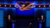President Donald Trump, left, and Democratic presidential candidate former Vice President Joe Biden, right, with moderator Chris Wallace, center, of Fox News during the first presidential debate, Sept. 29, 2020 in Cleveland, Ohio.