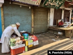 Some arrive early morning to set up roadside stalls hoping to catch customers as they emerge after prayers at the mosque.
