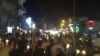 In this citizen journalism image made on a mobile phone Tuesday May 10, 2011 and acquired by the AP, Syrian anti-government protesters carry candles during a rally in the northeastern city of Qamishli, Syria. Syrian activists and eyewitnesses said on Wedn