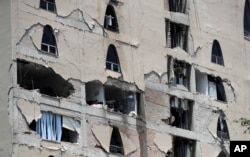 Remains of a damaged building stands after an earthquake in Mexico City, Tuesday, Sept. 19, 2017. A powerful earthquake has jolted Mexico, causing buildings to sway sickeningly in the capital on the anniversary of a 1985 quake that did major damage.
