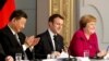 French President Emmanuel Macron, Chinese President Xi Jinping and German Chancellor Angela Merkel hold a news conference at the Elysee presidential palace in Paris, March 26, 2019. 