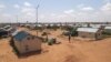 FILE - A man walks along a path in the Hamdallaye refugee camp amid the COVID-19 pandemic in Niger, July 29, 2020. (UNHCR/Selim Meddeb/Handout via Reuters) 