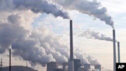 FILE - A coal-burning power plant 