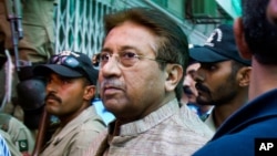 FILE - Pakistan's former President and military ruler Pervez Musharraf arrives at an anti-terrorism court in Islamabad, Pakistan, April 20, 2013. 