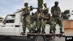 FILE - Burundi's security guards patrol in Bujumbra, Burundi, May 17, 2018. A spate of recent attacks on security forces and the ruling party's youth league has reportedly left dozens of people dead. 