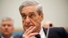 FBI Director Robert Mueller listens as he testifies on Capitol Hill in Washington, June 13, 2013.