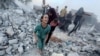 Palestinians react following an Israeli strike near a U.N.-run school sheltering displaced people in Khan Younis, Gaza Strip, in this still image taken from a video, July 3, 2024.