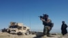 A member of Afghanistan's special forces points his gun as he observes the enemy lines in Achin district of Nangarhar province, in eastern Afghanistan April 14, 2017.