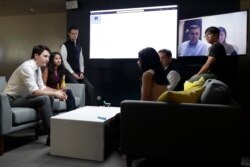 FILE - Canada's Prime Minister Justin Trudeau speaks with AppDirect employees at their office in San Francisco, Feb. 8, 2018. Trudeau was pitching Canada as a destination for American tech firms amid increasing unease over U.S. immigration policy.