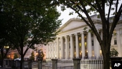 FILE - In this Wednesday, Oct. 16, 2013, file photo, the U.S. Treasury Building stands in Washington. On Friday, April 15, 2016, the Treasury Department reports on foreign holdings of U.S. debt for February. 