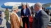 U.S. Secretary of State John Kerry chats with U.S. Ambassador to Oman Marc Sievers, and Omani Foreign Minister Yusuf bin Alawi on November 15, 2016, before the Secretary departed from Muscat International Airport in Muscat, Oman, following a bilateral visit to the country.