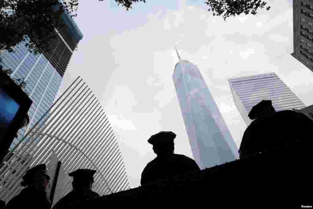(FILE)Police officers stand outside Ground Zero on the morning of the 15th anniversary of the 9/11 attacks in Manhattan, New York, U.S., September 11, 2016. REUTERS/Andrew Kelly