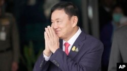 FILE - Thai former Prime Minister Thaksin Shinawatra arrives at Don Muang airport in Bangkok, Thailand, on Aug. 22, 2023.