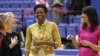 First lady Michelle Obama and Samantha Cameron, wife of British Primer Minister David Cameron, talk with United States Women's National Soccer Team midfielder Lori Ann Lindsey, left, and defender Becky Sauerbrunn as they join with students participating i