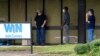 FILE - Clients line up outside the Mississippi Department of Employment Security WIN Job Center in Pearl, Aug. 31, 2020. 
