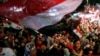 FILE - Supporters of Egypt's army and police gather at Tahrir square in Cairo, on the third anniversary of Egypt's uprising, Jan. 25, 2014. The government, wary of new protests, has tightened security in Cairo.