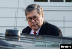FILE - Attorney General William Barr leaves his house.
